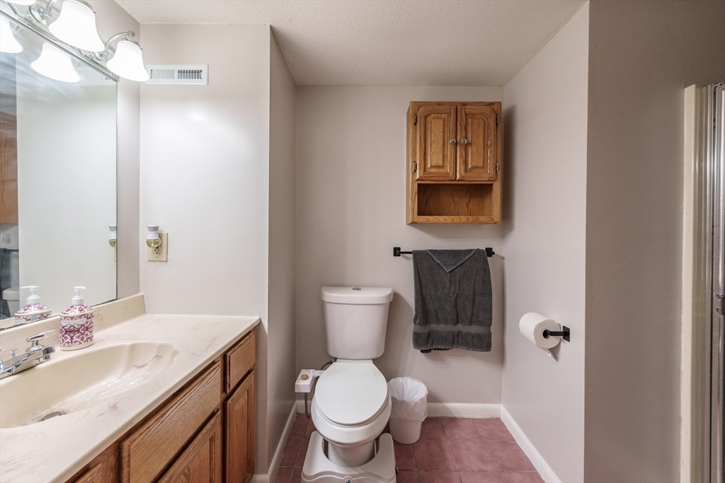 267 Maple Street East Longmeadow, MA 01028 - Photo 14 of 25 a bathroom with a toilet sink and mirror