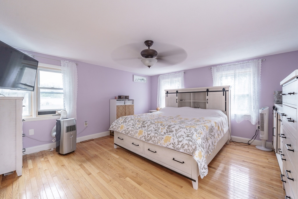 267 Maple Street East Longmeadow, MA 01028 - Photo 15 of 25 a bedroom with a bed and wooden floor