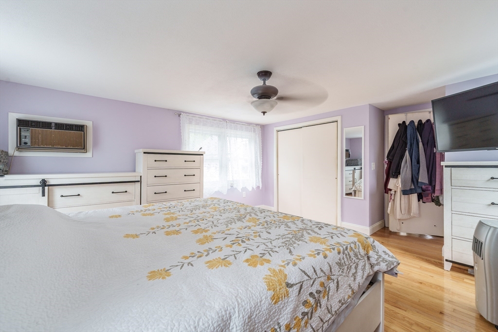 267 Maple Street East Longmeadow, MA 01028 - Photo 17 of 25 a bedroom with a bed and a flat screen tv