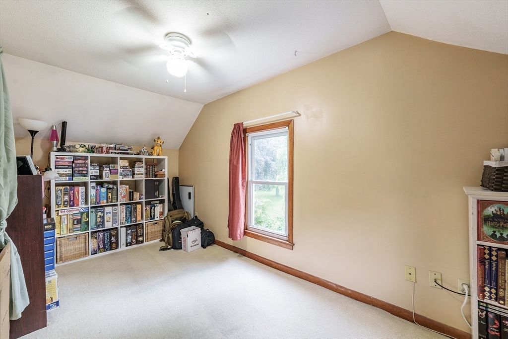 267 Maple Street East Longmeadow, MA 01028 - Photo 19 of 25 a living room with lots of books and a large window