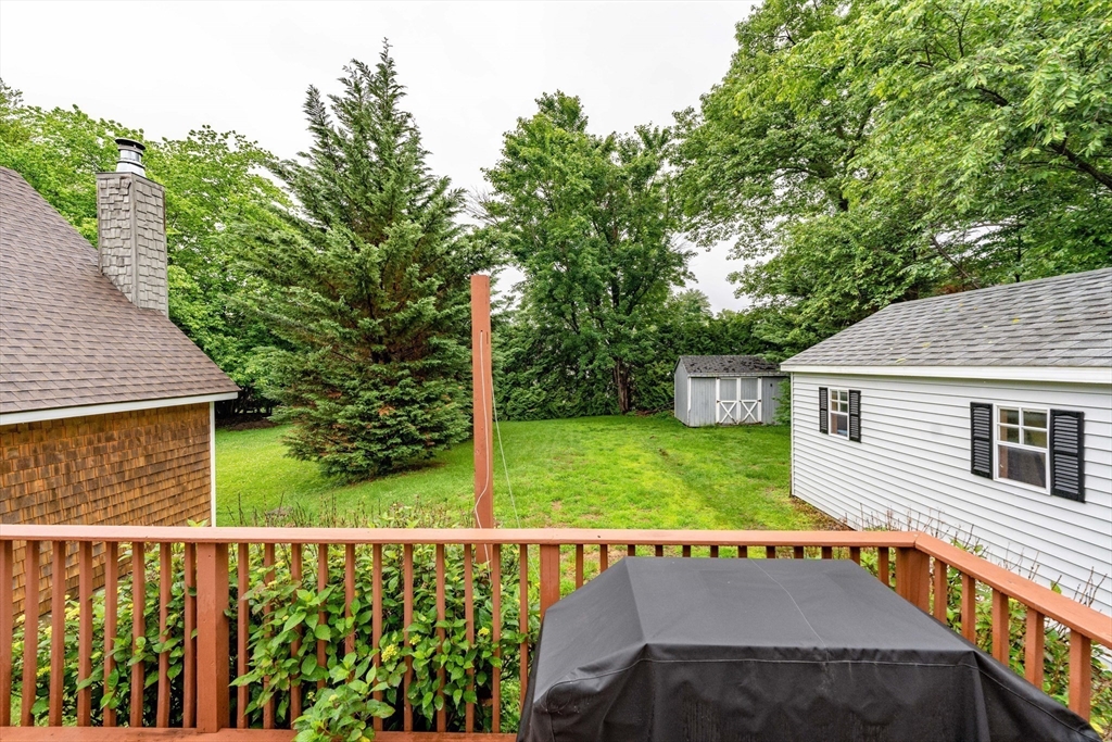 267 Maple Street East Longmeadow, MA 01028 - Photo 21 of 25 a view of a patio with table and chairs with wooden fence and plants