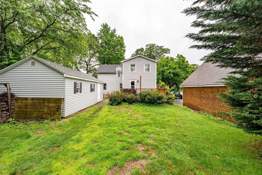 267 Maple Street East Longmeadow, MA 01028 - Photo 24 of 25 a front view of a house with a yard and garage