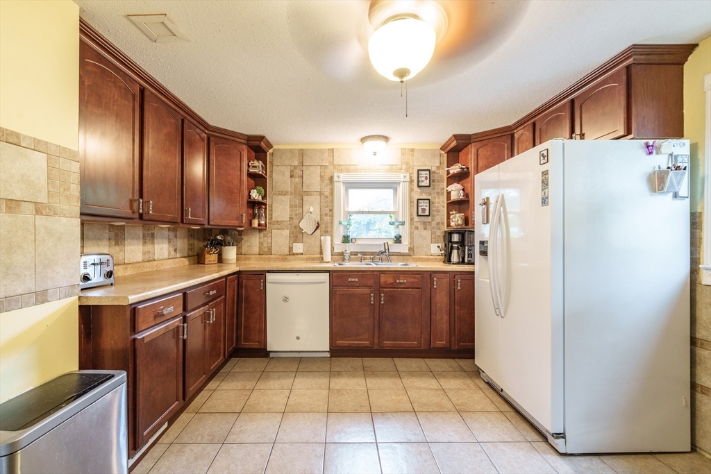 267 Maple Street East Longmeadow, MA 01028 - Photo 6 of 25 a kitchen with a refrigerator a sink and dishwasher