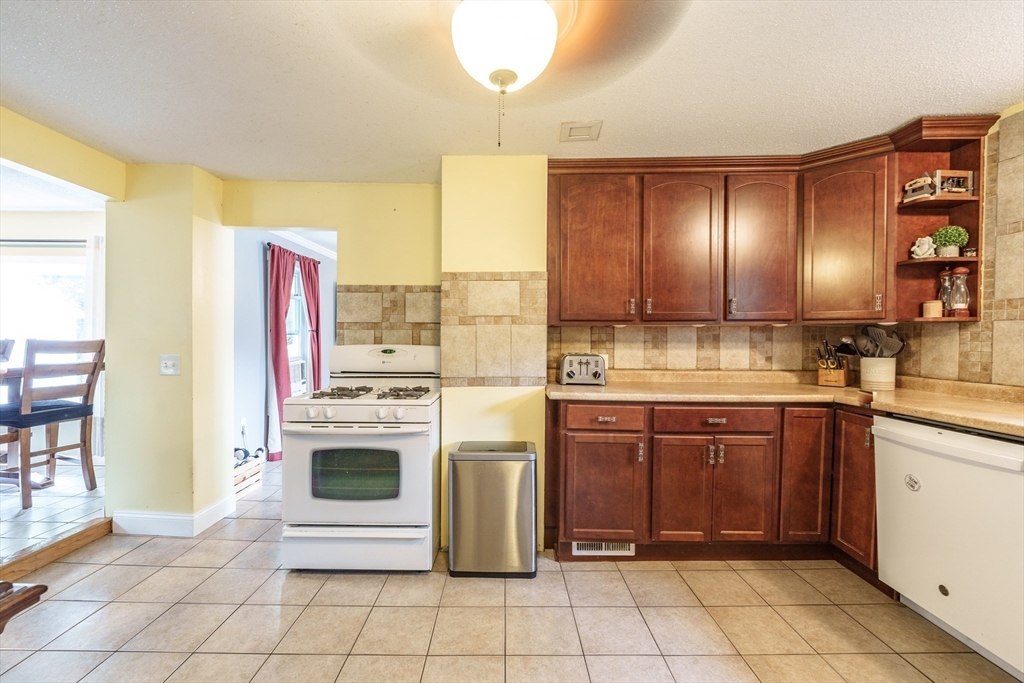 267 Maple Street East Longmeadow, MA 01028 - Photo 7 of 25 a kitchen with stainless steel appliances a stove a sink and a refrigerator