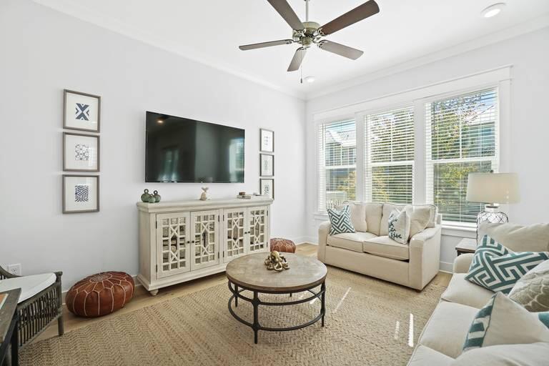 a living room with furniture and a flat screen tv