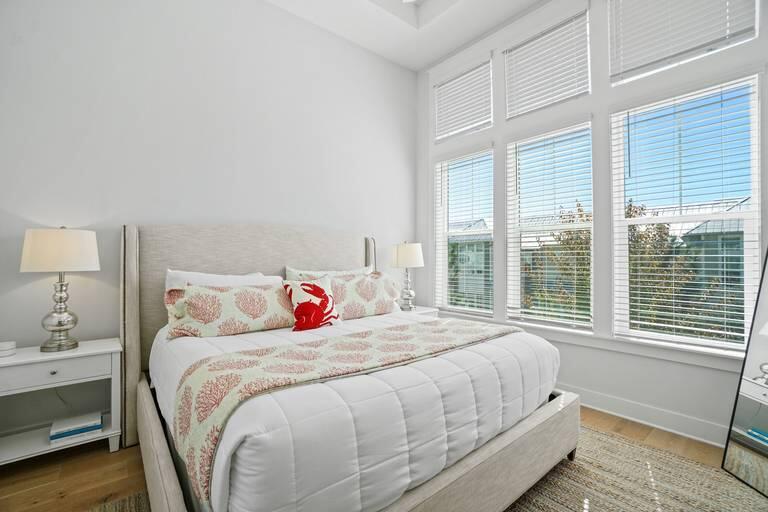 296 Milestone Dr Inlet Beach, Unit B Inlet Beach, FL 32461 - Photo 2 of 4 a bedroom with a bed and a window