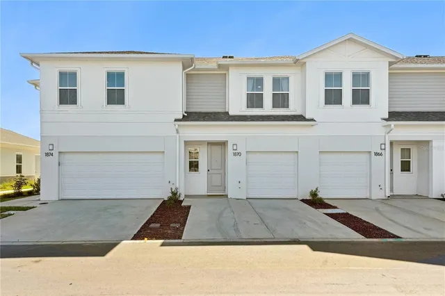 a view of a house with a garage