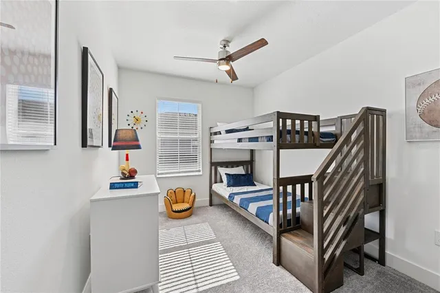 a bathroom with a sink a toilet and a shower