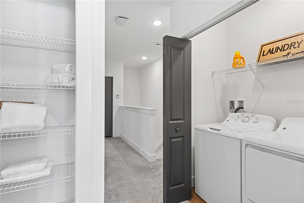 1898 Zac Street, Unit RADIANCE Kissimmee, FL 34743 - Photo 13 of 20 a bathroom with a sink a toilet and a shower