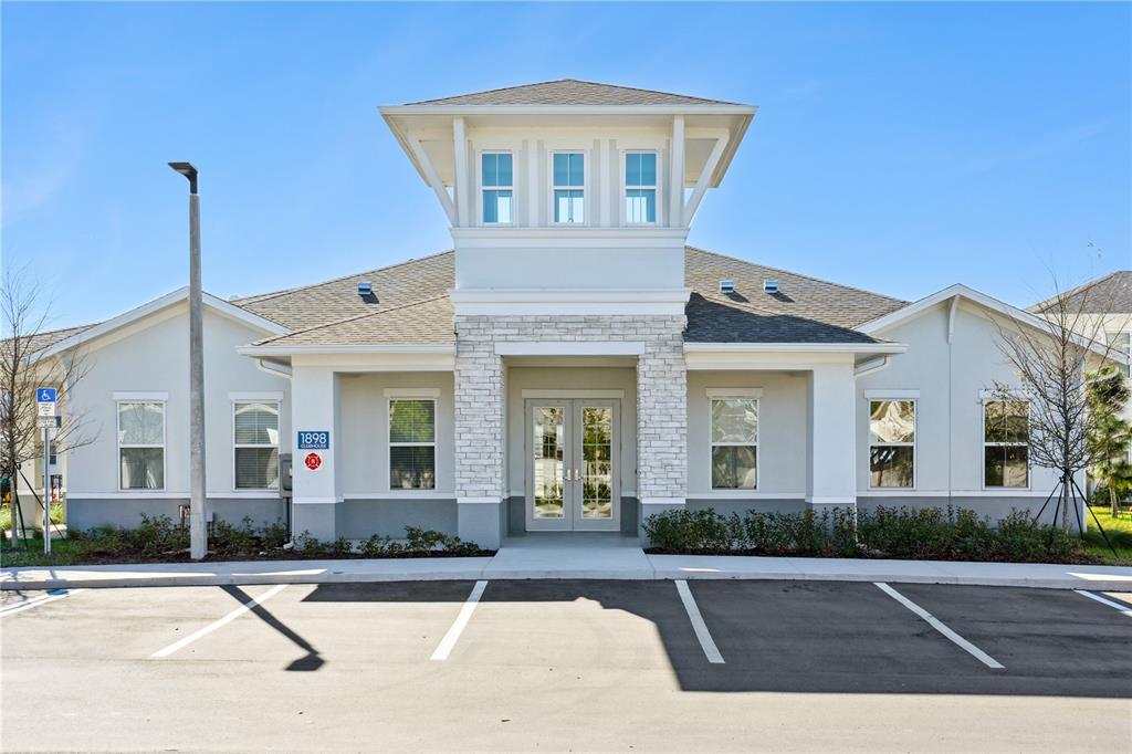 1898 Zac Street, Unit RADIANCE Kissimmee, FL 34743 - Photo 15 of 20 a front view of a house with yard