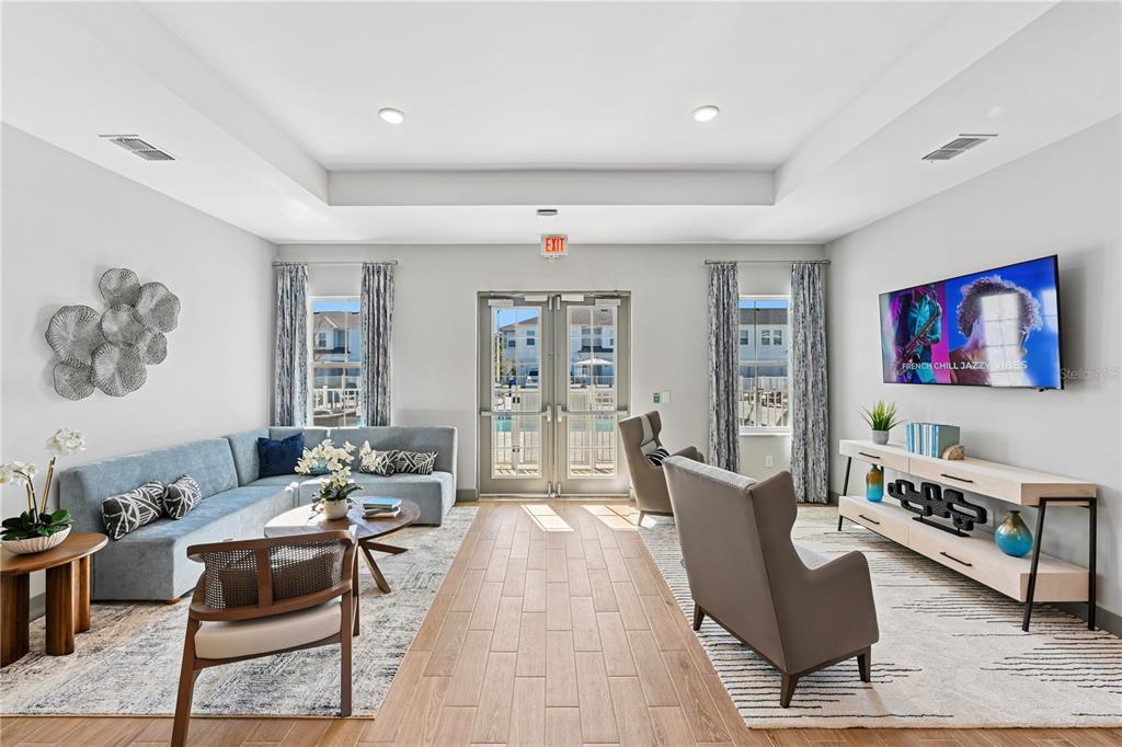 1898 Zac Street, Unit RADIANCE Kissimmee, FL 34743 - Photo 17 of 20 a living room with furniture and a rug