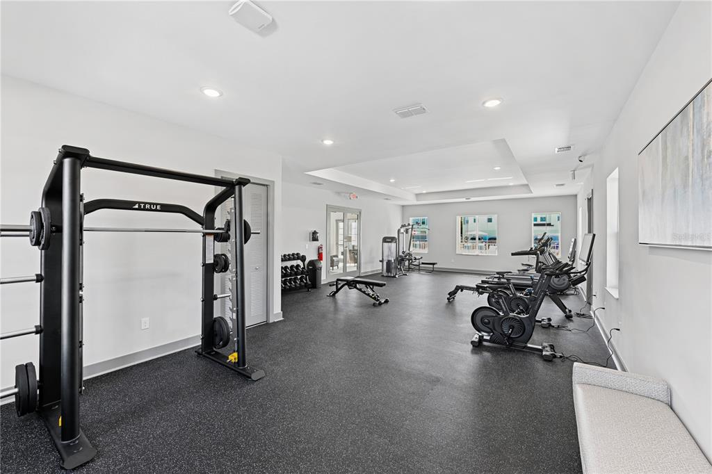 1898 Zac Street, Unit RADIANCE Kissimmee, FL 34743 - Photo 18 of 20 a view of a room with gym equipment