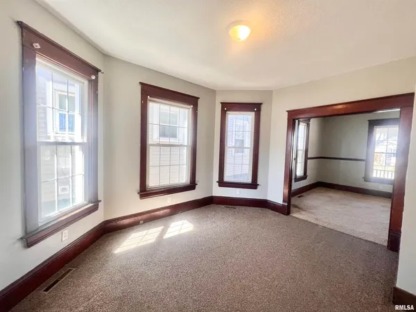 a view of empty room with windows