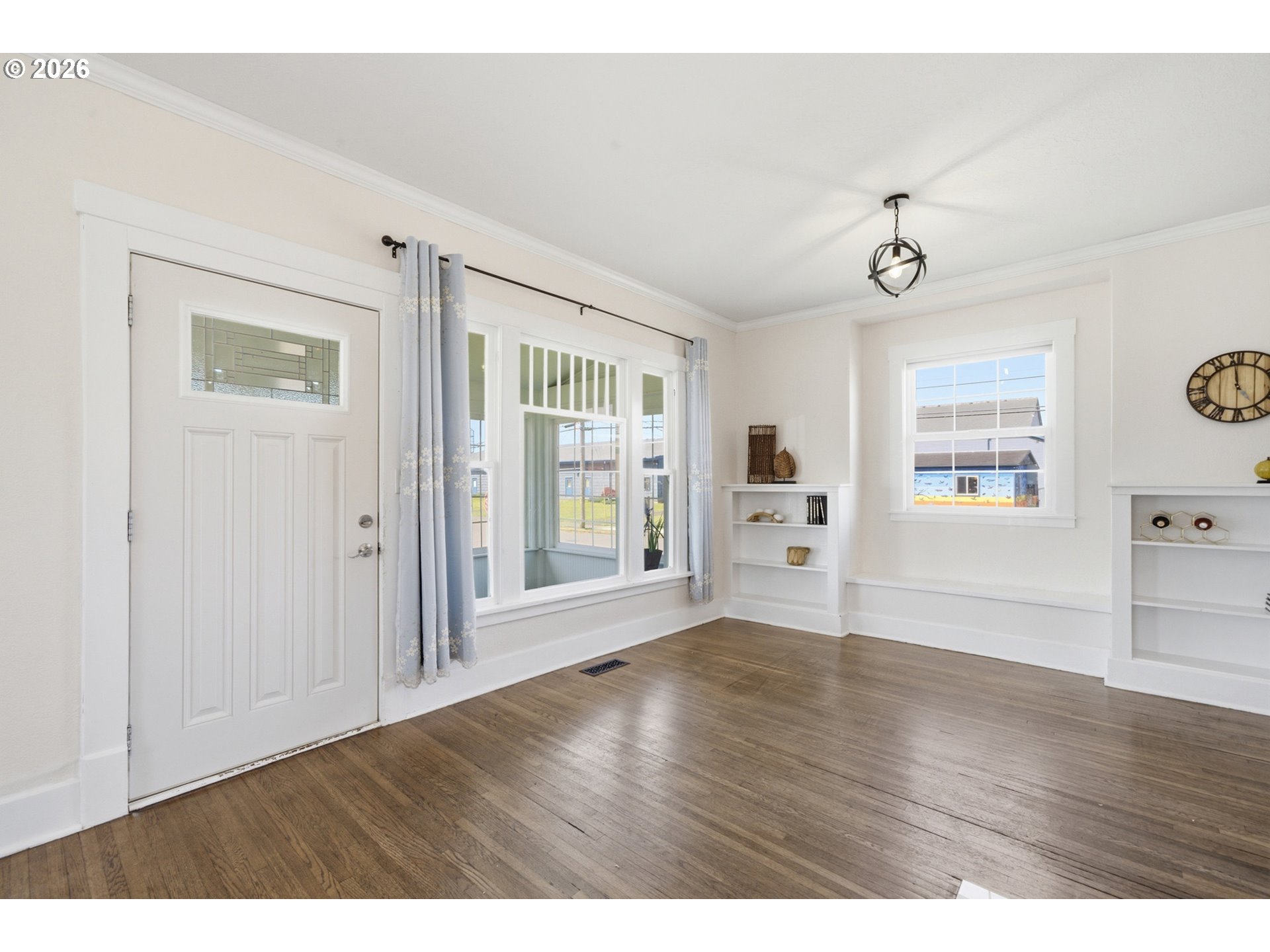 1802 8th Street Tillamook, OR 97141 - Photo 11 of 37 a view of an empty room with a window and wooden floor