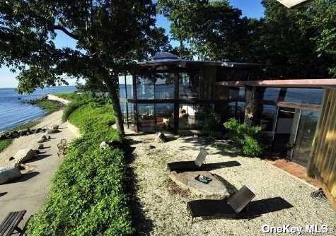 48 Westland Drive Glen Cove, NY 11542 - Photo 15 of 25 a view of house with yard outdoor seating and green space