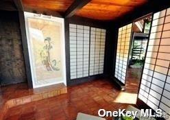 48 Westland Drive Glen Cove, NY 11542 - Photo 17 of 25 a view of an empty room with windows