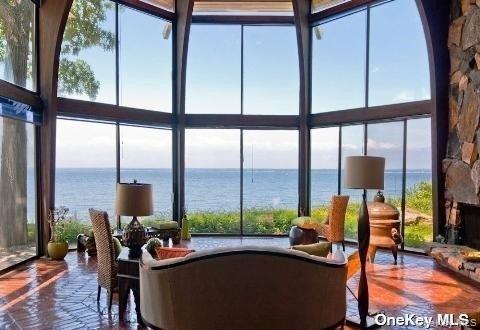 48 Westland Drive Glen Cove, NY 11542 - Photo 2 of 25 a living room with furniture and a floor to ceiling window