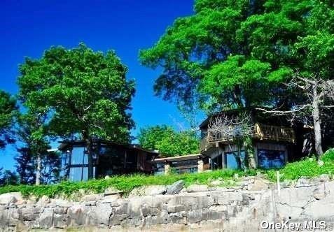 48 Westland Drive Glen Cove, NY 11542 - Photo 23 of 25 a backyard of a house with lots of green space