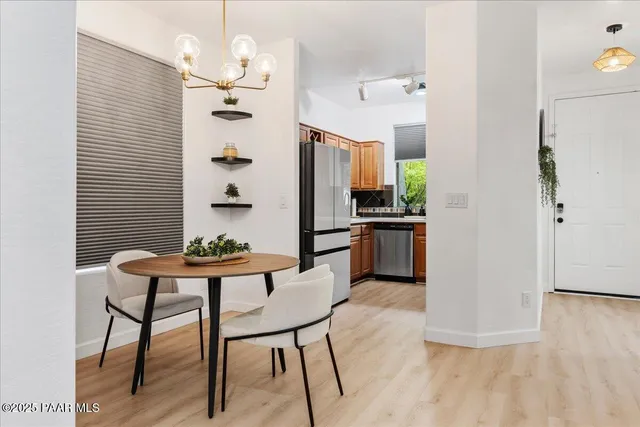 a view of kitchen with furniture and wooden floor