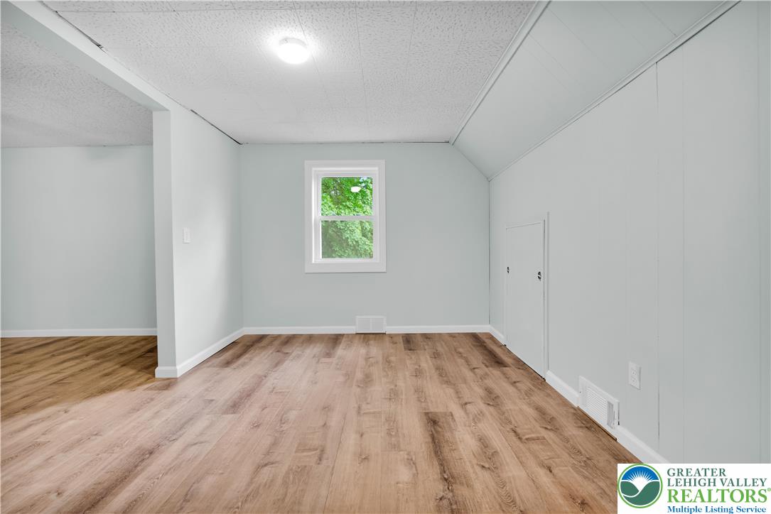 2242 Church Road Bethlehem, PA 18015 - Photo 43 of 74 an empty room with wooden floor and windows