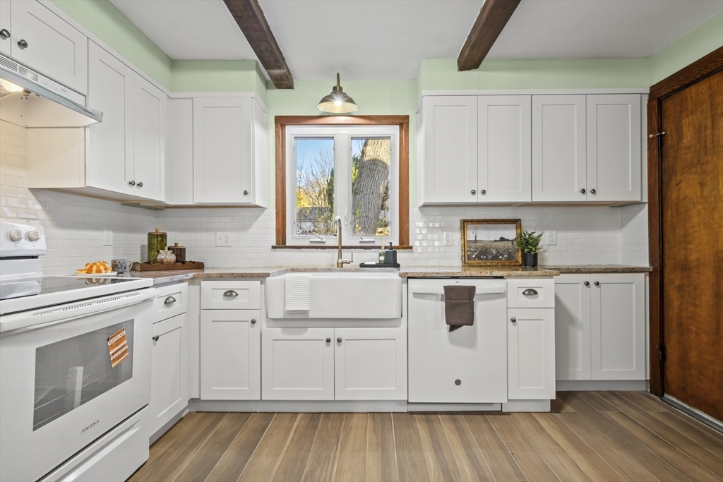 2 Overlook Road Wakefield, MA 01880 - Photo 17 of 42 a kitchen with white cabinets and white appliances