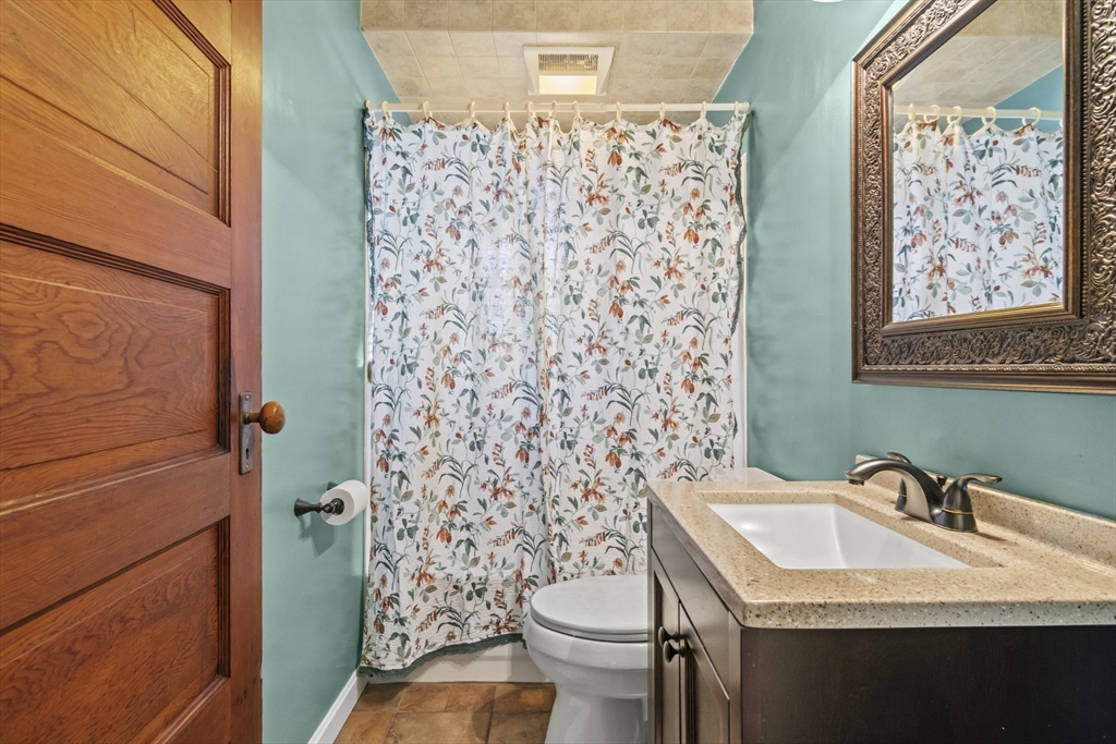 2 Overlook Road Wakefield, MA 01880 - Photo 21 of 42 a bathroom with a granite countertop sink toilet and shower