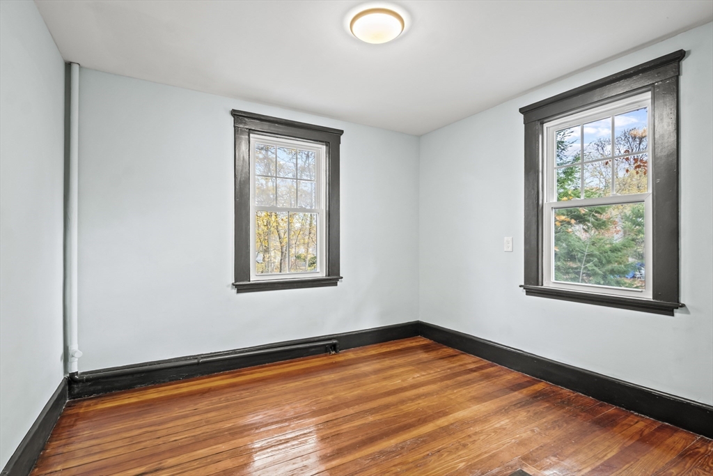 2 Overlook Road Wakefield, MA 01880 - Photo 25 of 42 a view of an empty room with wooden floor and a window