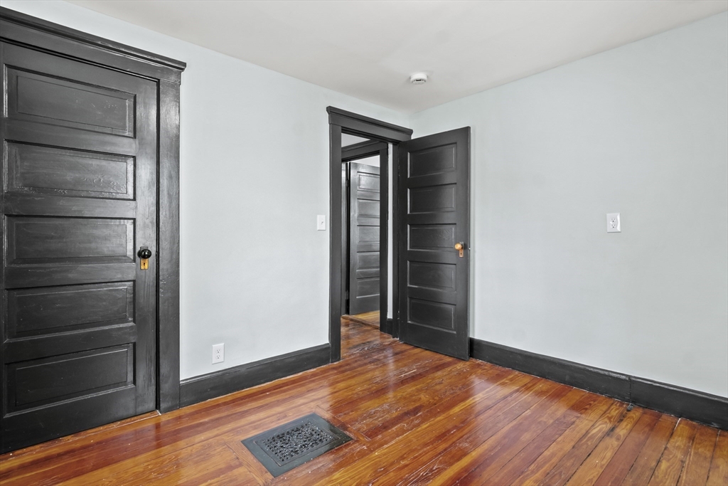 2 Overlook Road Wakefield, MA 01880 - Photo 27 of 42 a view of an empty room with wooden floor and a window