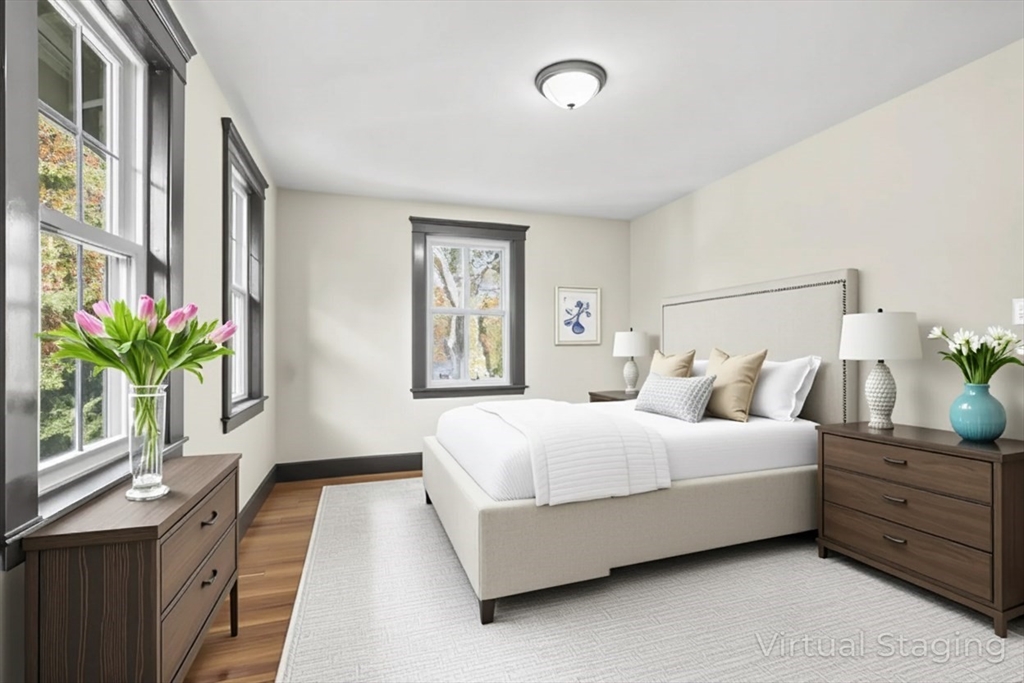 2 Overlook Road Wakefield, MA 01880 - Photo 28 of 42 a bedroom with a bed and a potted plant