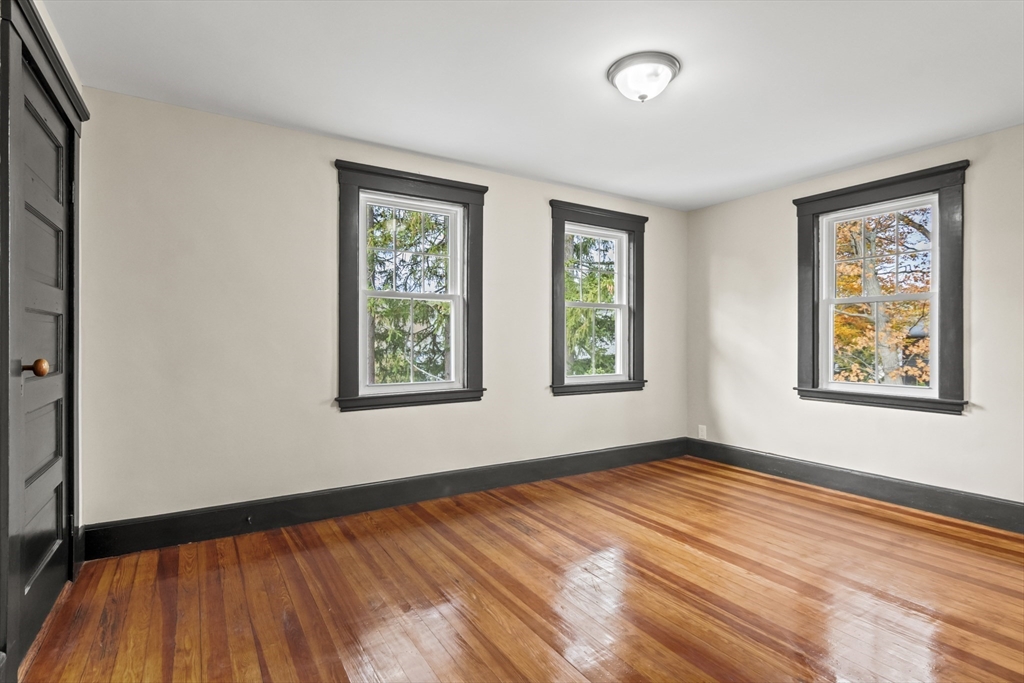 2 Overlook Road Wakefield, MA 01880 - Photo 29 of 42 a view of an empty room with window and wooden floor