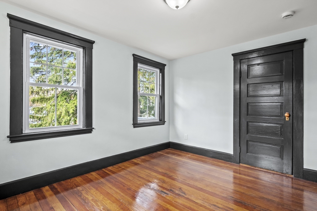 2 Overlook Road Wakefield, MA 01880 - Photo 32 of 42 a view of an empty room with wooden floor and a window