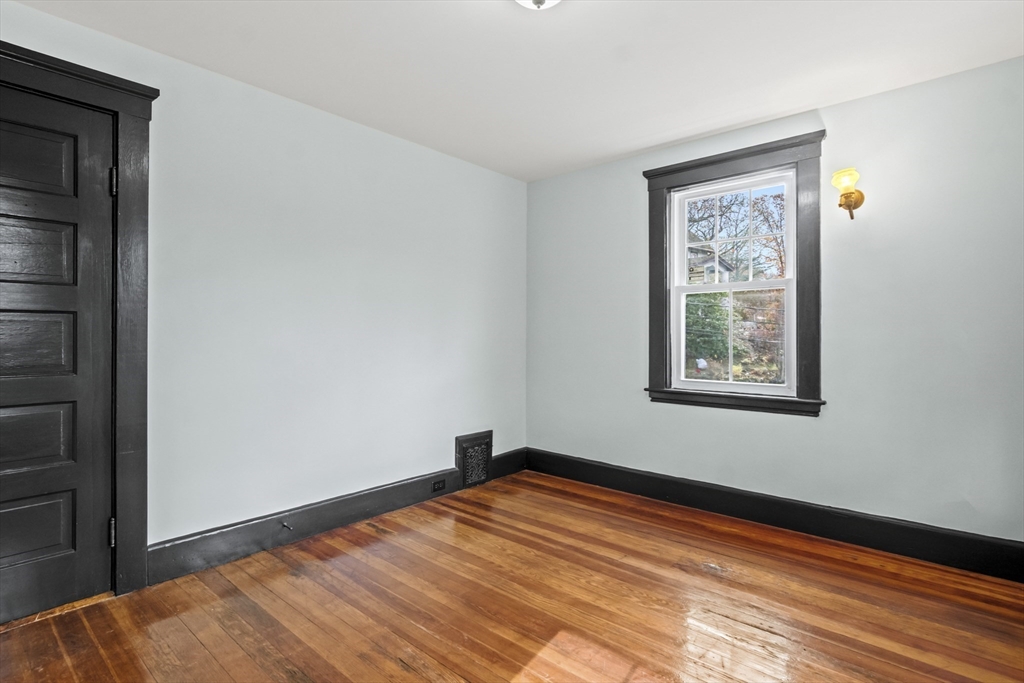 2 Overlook Road Wakefield, MA 01880 - Photo 33 of 42 a view of an empty room with wooden floor and a window