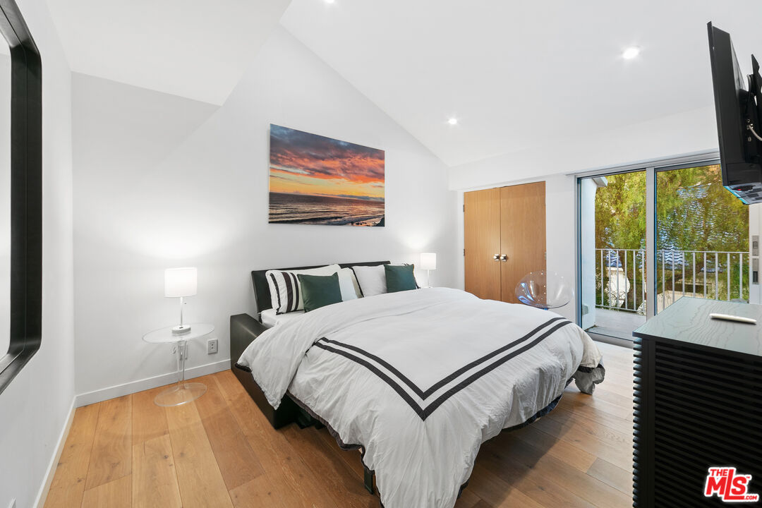 31666 Broad Beach Road Malibu, CA 90265 - Photo 16 of 23 a spacious bedroom with a bed and large windows