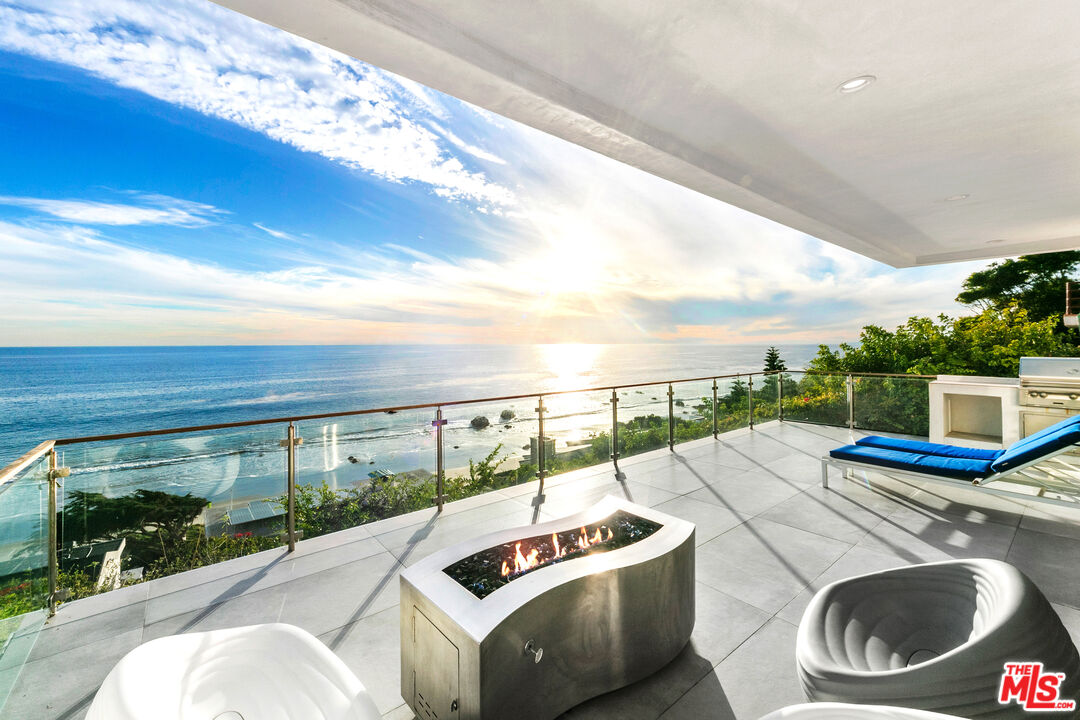 31666 Broad Beach Road Malibu, CA 90265 - Photo 4 of 23 a terrace with outdoor seating and city view
