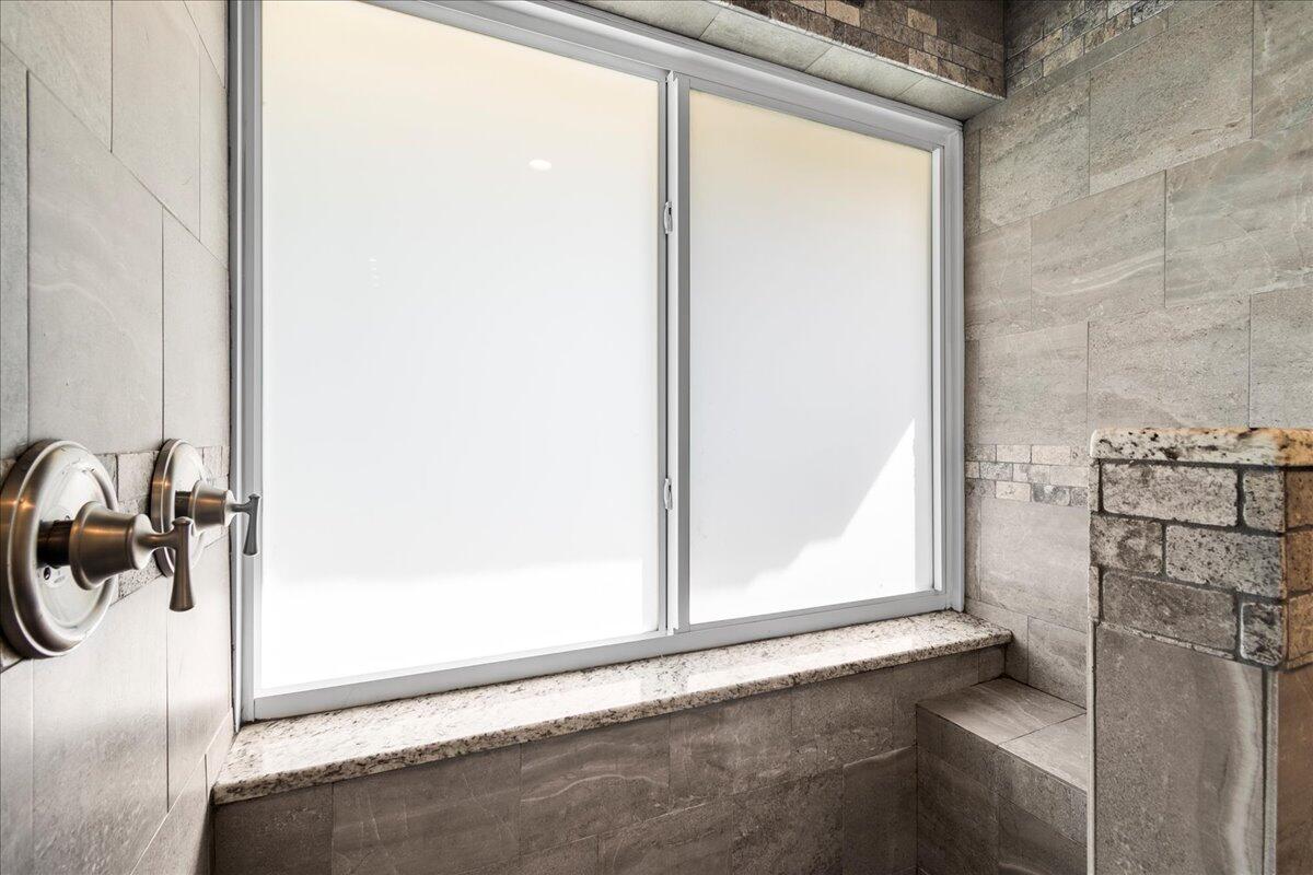 1969 Southwest 36th Avenue Delray Beach, FL 33445 - Photo 17 of 40 Renovated Primary Shower with Bench