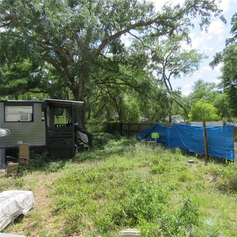 a view of backyard with green space