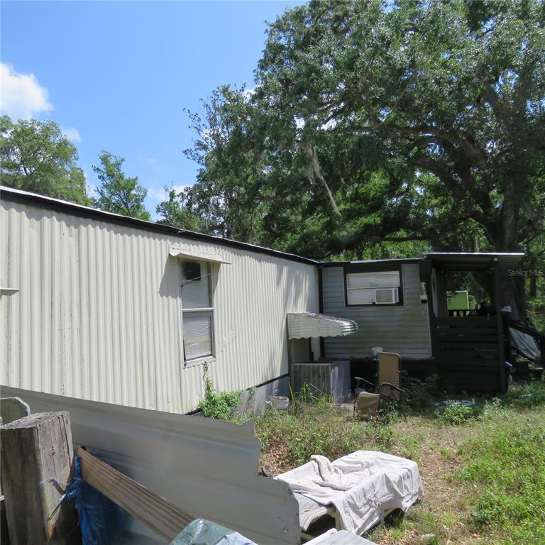 8505 Franklin Road Plant City, FL 33565 - Photo 20 of 25 a backyard of a house with seating space