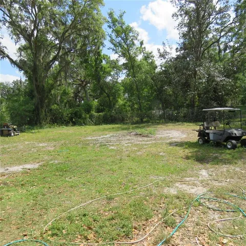 a view of a water fountain in a yard