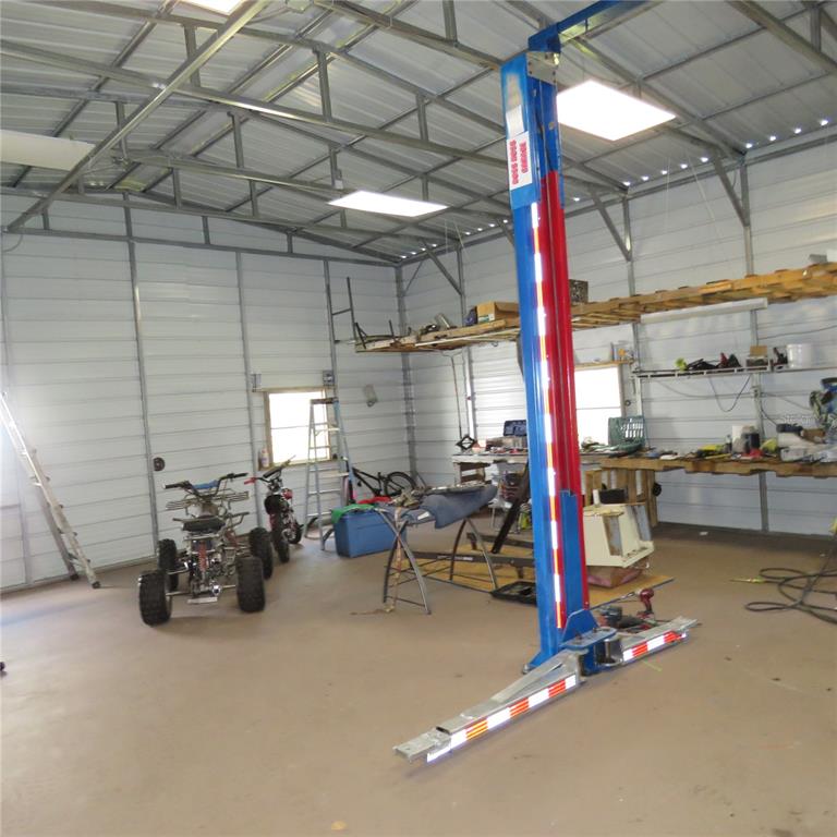 8505 Franklin Road Plant City, FL 33565 - Photo 3 of 25 a view of a storage room with furniture