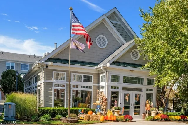 a kitchen with stainless steel appliances granite countertop a refrigerator and a stove