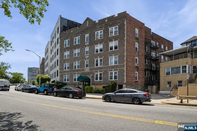 a view of a cars parked in front of a building