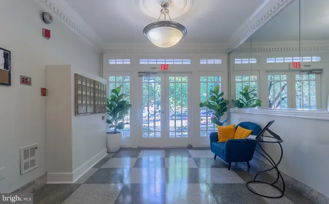 a view of a dining room with furniture wooden floor and chandelier