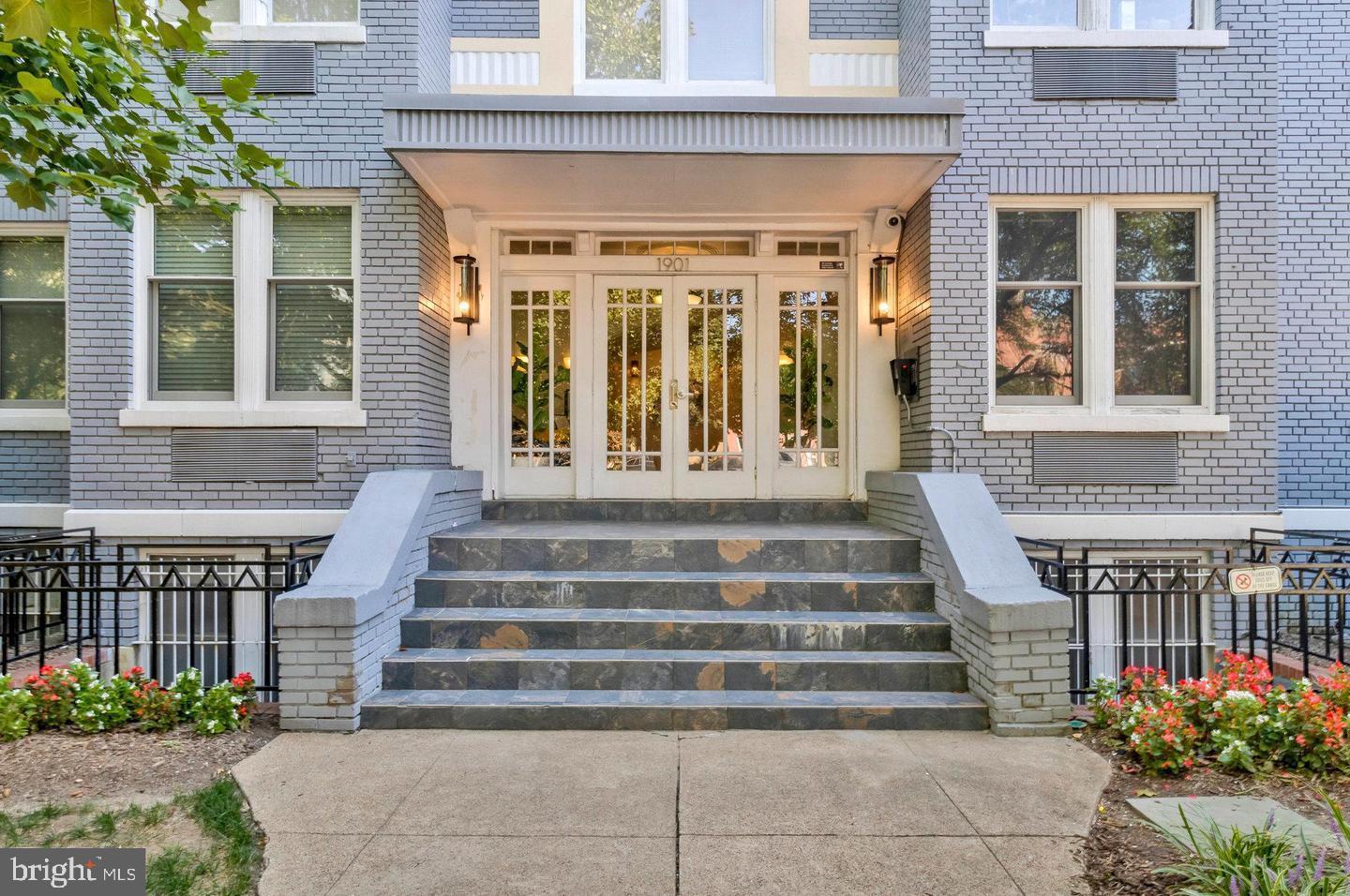 1901 16th Street Northwest, Unit 11 Washington, DC 20009 - Photo 2 of 13 a front view of a house with potted plants