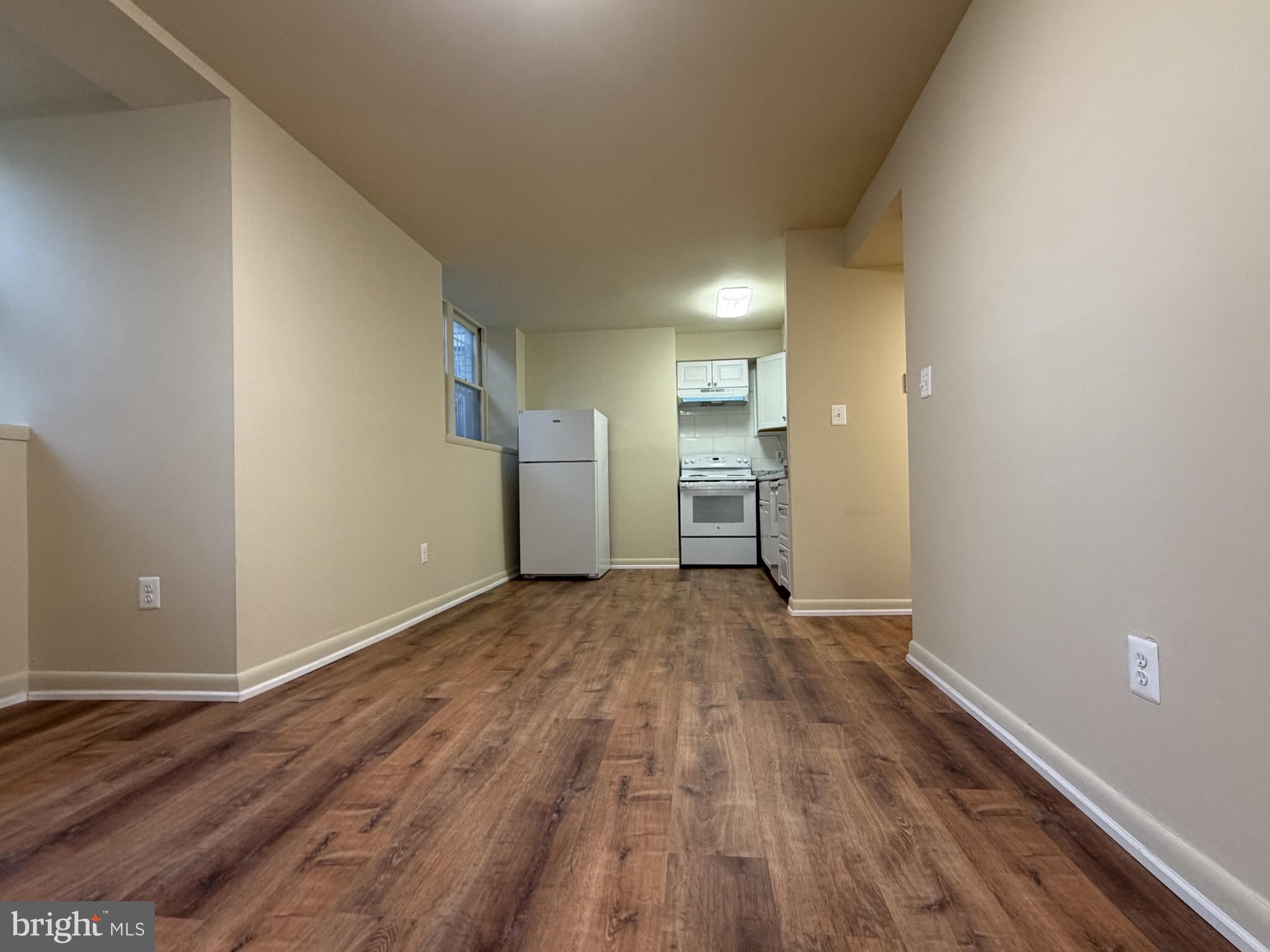1901 16th Street Northwest, Unit 11 Washington, DC 20009 - Photo 8 of 13 a view of empty room with wooden floor