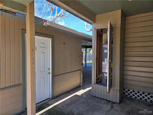 a view of a balcony with wooden floor and outdoor seating