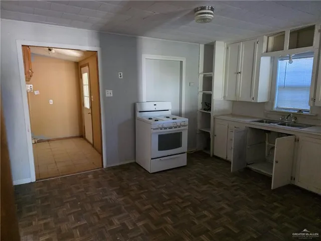 a kitchen with a stove and a microwave