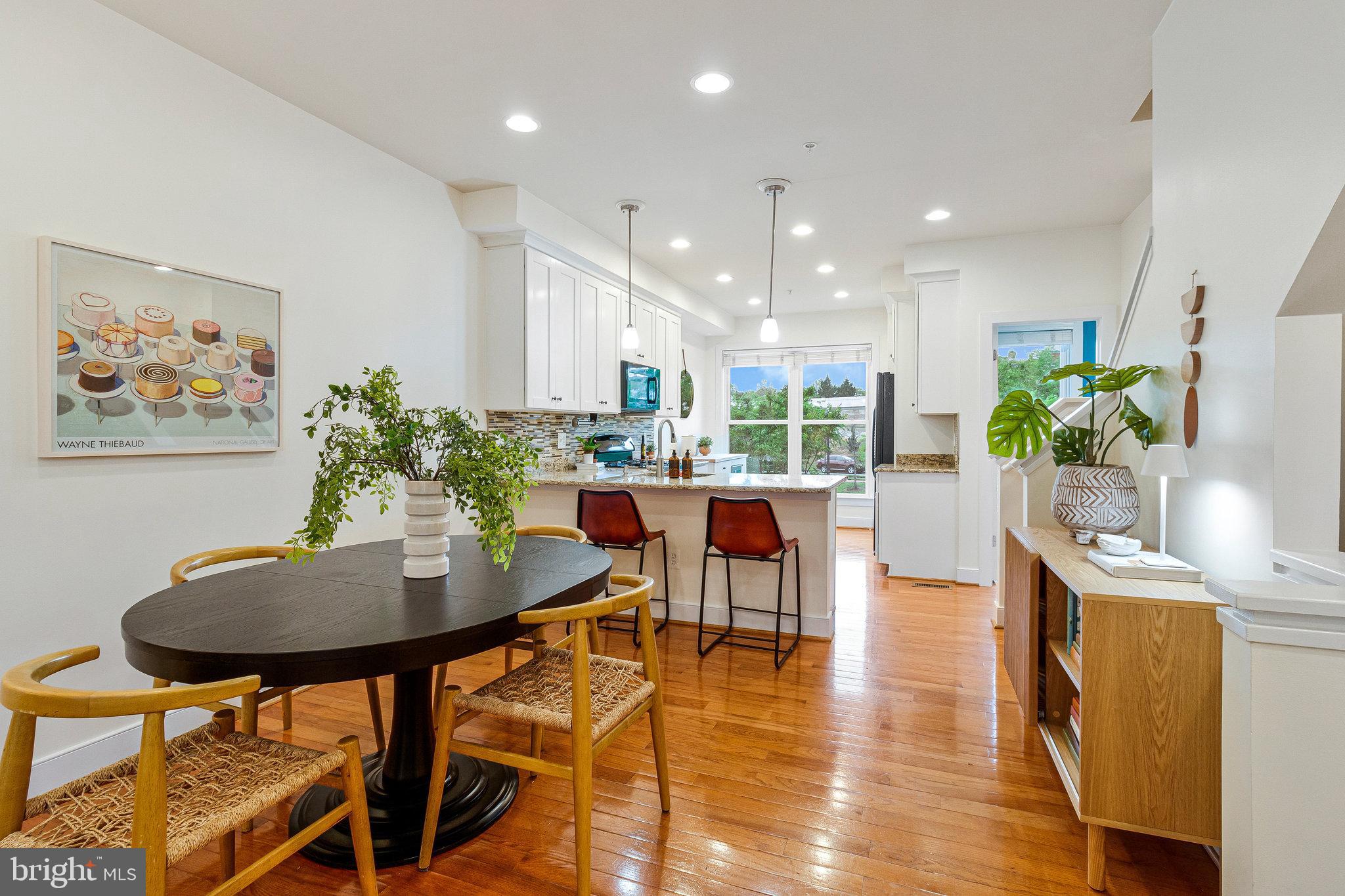 415 I Street Southeast Washington, DC 20003 - Photo 12 of 58 a dining room with furniture and wooden floor