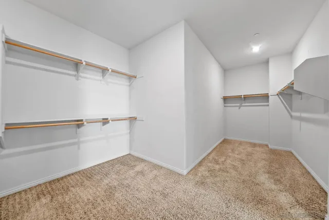 a view of storage and utility room with empty racks