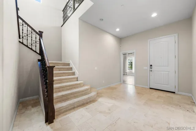 a view of entryway with stairs