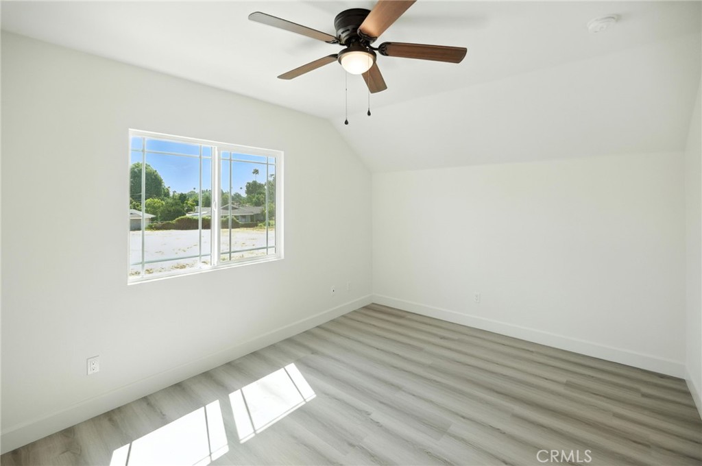 5151 Peony Court Riverside, CA 92506 - Photo 17 of 23 wooden floor in an empty room with a window